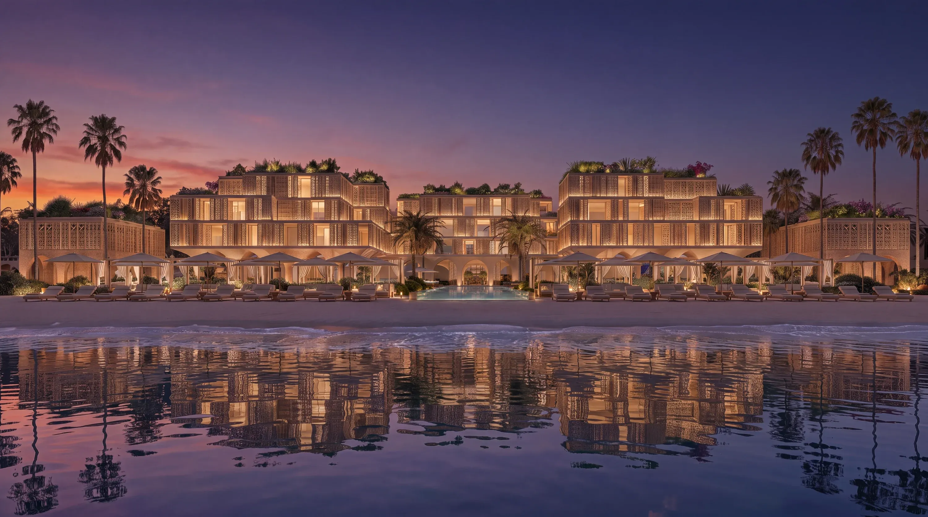 The beachfront residences of Mira Ocean Estates seen from the sand at dusk