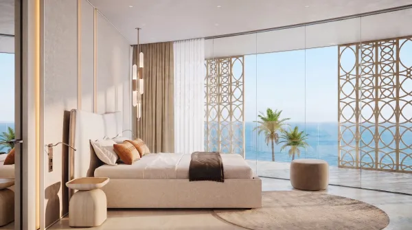 A furnished bedroom at Trussardi Residences looking out to the sea