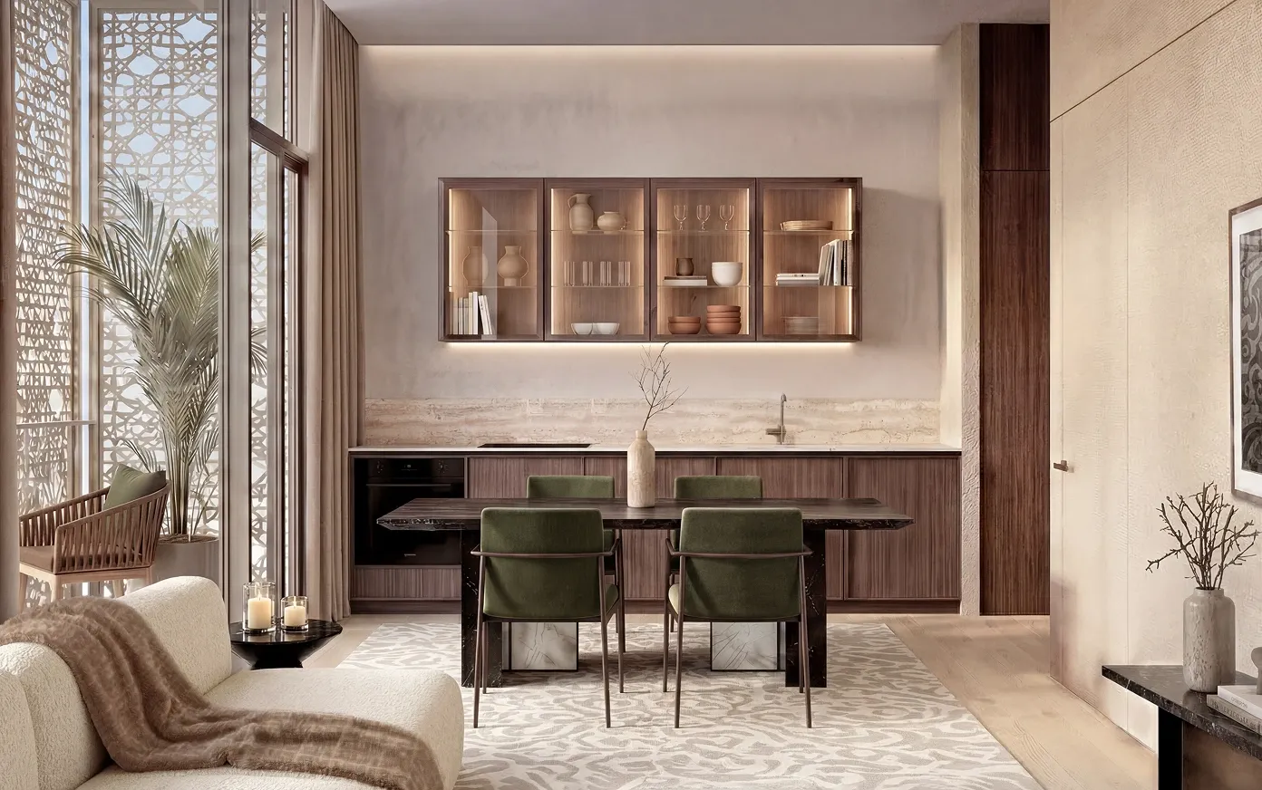 The kitchen and dining room of a Richmond Residences apartment, its table set below a lit display cabinet beside a mashrabiya-screened window